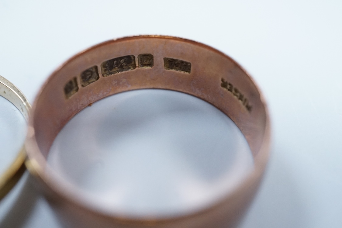 A 1970's 9ct gold wedding band, size W, a George V 9ct rose gold wedding band, 9.3 grams, a 1970's 18ct gold sapphire and diamond cluster ring, gross weight 4 grams, a modern silver mounted photograph frame, a modern sil